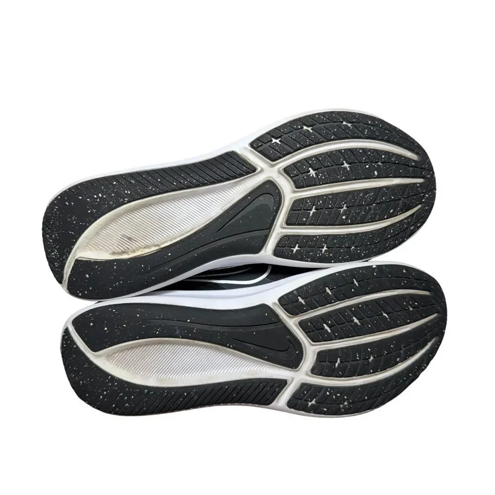 Nike women’s Black and White Low-Top Running Shoe size 5.5Y